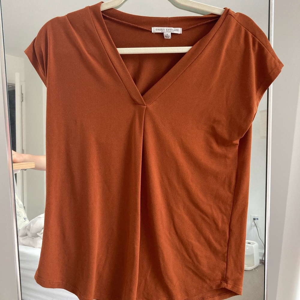 Burnt orange blouse. Fits small / xs. Business casual or casual